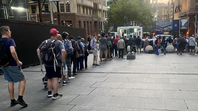 A long queue in Martin place of people waiting to look through the clothing racks. Picture: Facebook.