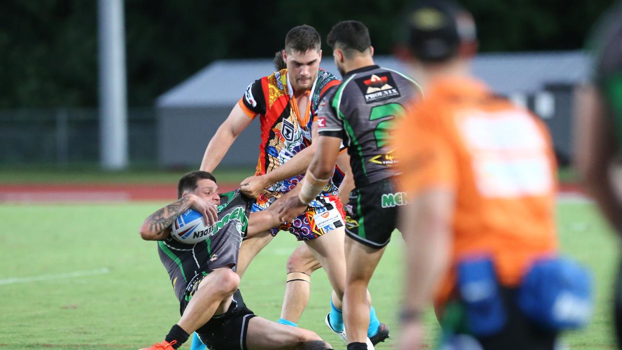 Pride's Evan Child drags a Blackhawks player into touch. Intrust Super Cup: Northern Pride v Townsville Blackhawks at Barlow Park, Cairns. PICTURE: Matthew McInerney