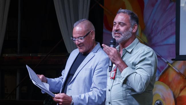 Andrew O’Keefe (right), with Pastor Ross Pene, congratulates the his band of brothers at graduation night at the Connect Global rehab centre at Swan Bay. Picture: David Swift