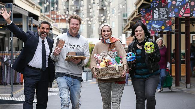 QVM chief executive Stan Liacos with traders at the revamped String Bean Alley.