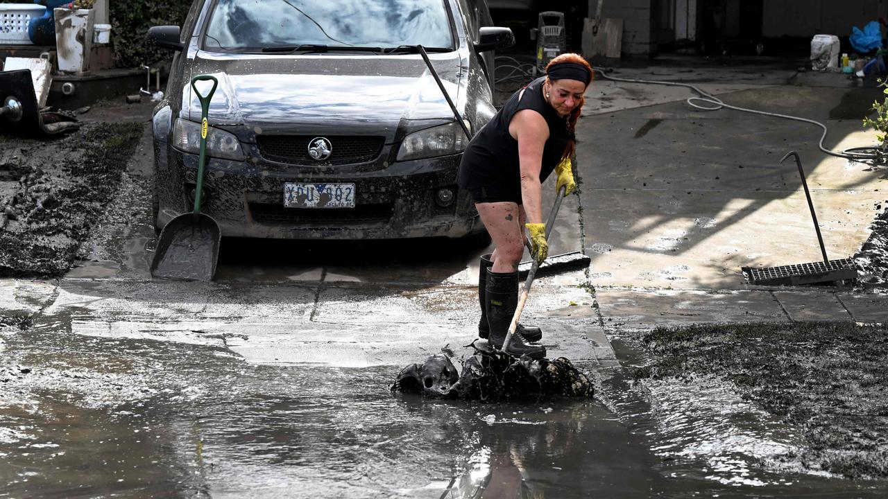 The clean-up is on in Maribyrnong after flood waters receded. Picture: AFP