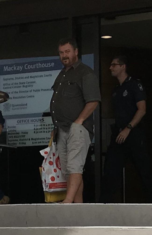 South Mackay's Larry Murchie (front) was found guilty of spitting on a woman after ramming her car with his Vesper.