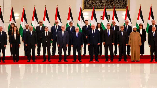 Palestinian Authority President Mahmud Abbas poses for a picture with new Palestinian government, after it was sworn in, in Ramallah, in the occupied West Bank. Picture: AFP