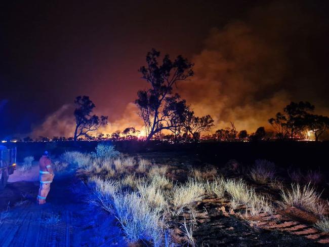 Bushfires NT crews and volunteers worked to backburn a fire in Alice Springs on Sunday. Picture: Supplied