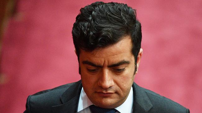 Labor Senator Sam Dastyari leaves after Question Time in the Senate chamber at Parliament House in Canberra, Tuesday, December 5, 2017. (AAP Image/Mick Tsikas) NO ARCHIVING