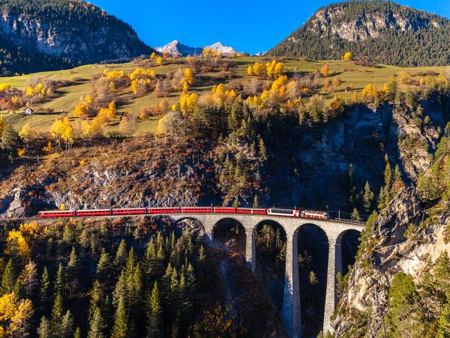 The Rhaetian Railway running on the famous Landwasser Viaduct in Canton of Grisons, Switzerland