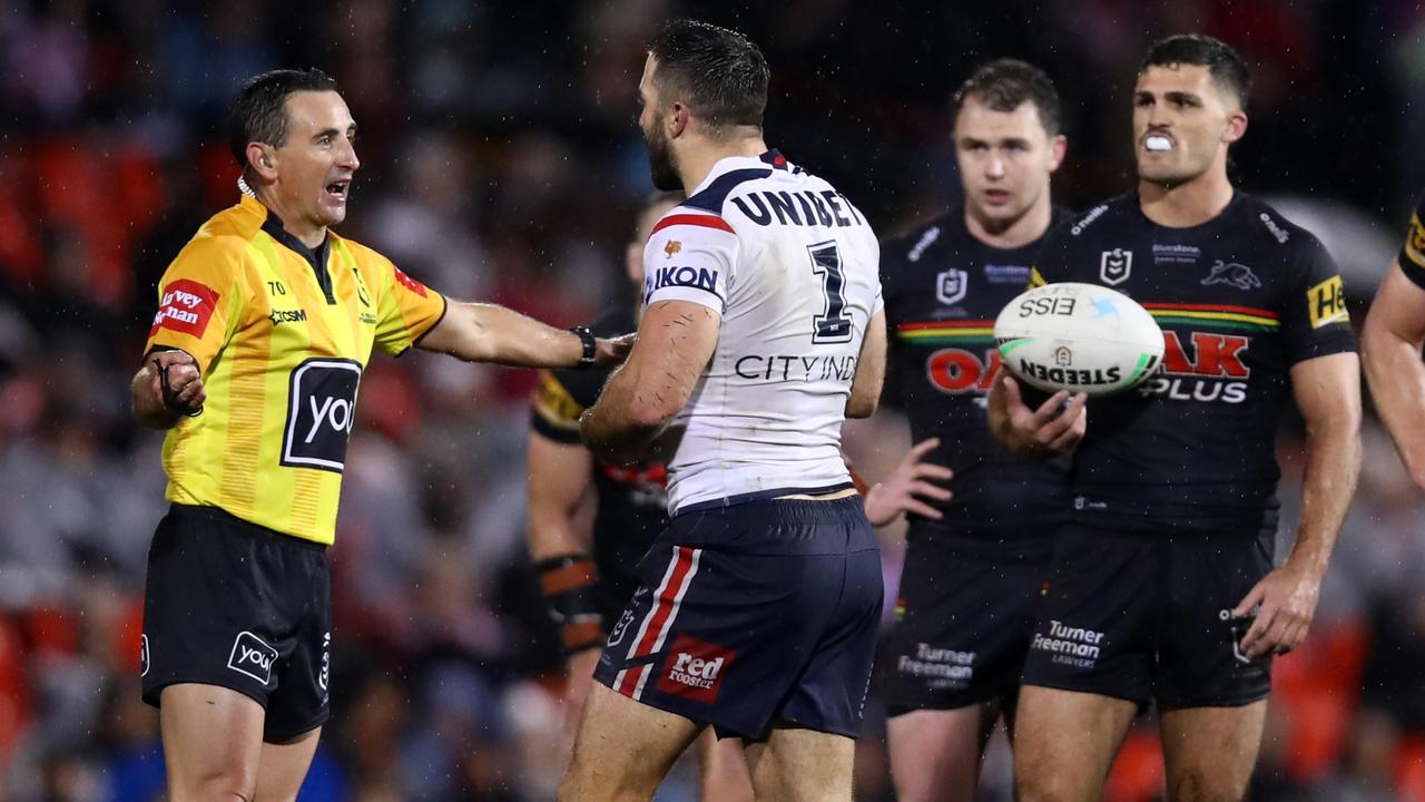 Roosters skipper James Tedesco speaks to referee Gerard Sutton during the clash against the Panthers. Picture: Jason McCawley/Getty Images