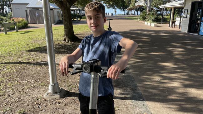 William Jacks on a Bird e-scooter on the Esplanade near the pier, Hervey Bay.