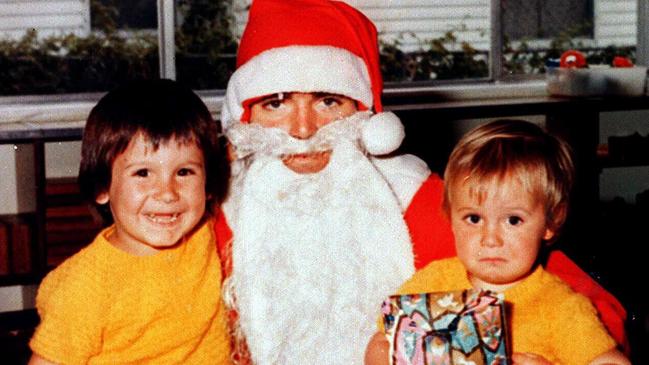 Santa Claus gives the young Roar supporter on the right a season pass and the one on the left nothing.