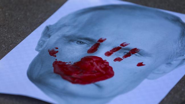 A placard showing a picture of Russian President Vladimir Putin at a rally in support of Ukraine in Santa Monica, California. Picture: AFP