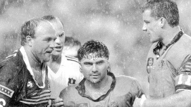 Benny Elias stands between Wally Lewis and Mark Geyer in State of Origin Game 1991.