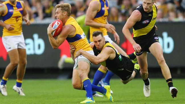 Sam Mitchell is tackled by Jason Castagna.