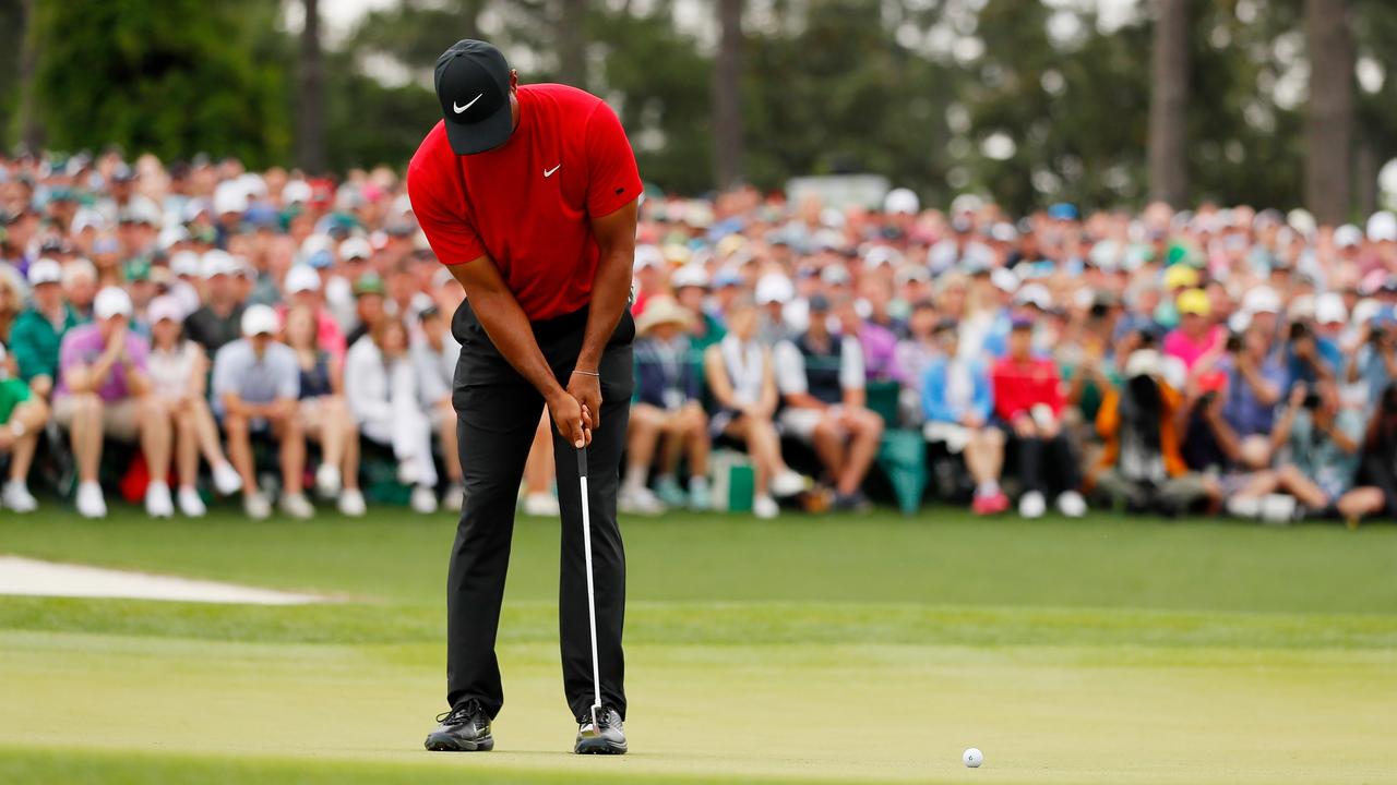 Woods on the 18th green at the Masters.