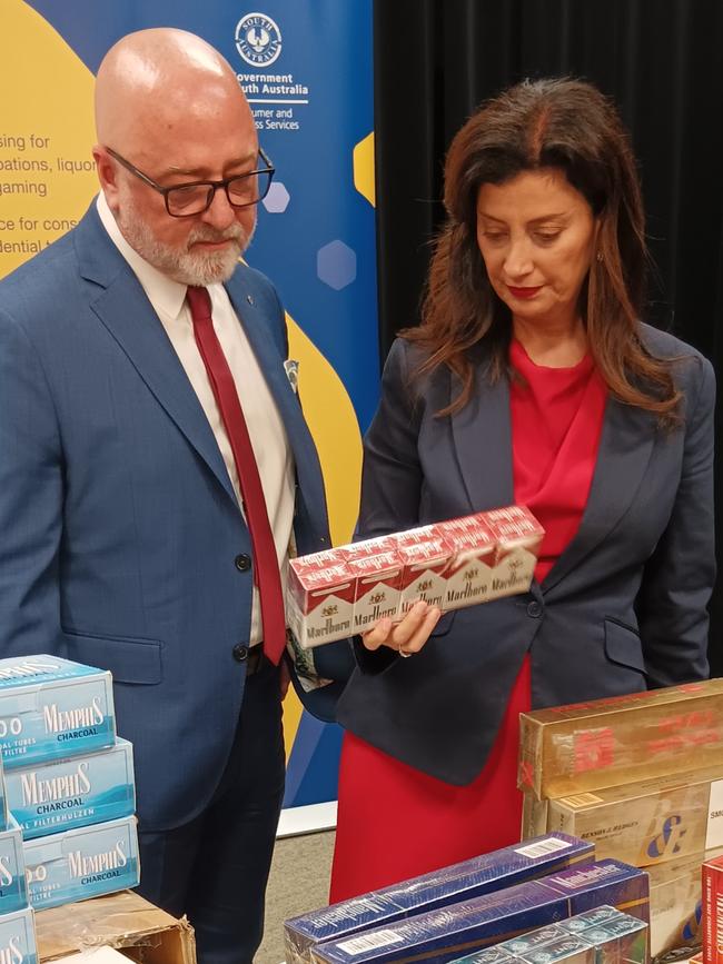 Consumer Affairs Commissioner Martyn Campbell and CBS Minister Andrea Michaels inspecting some of the illegal tobacco items seized during a raise in the north-eastern suburbs. Picture: Elizabeth Henson