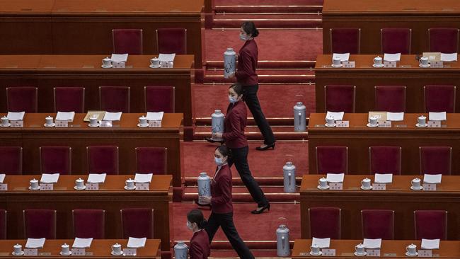 Tea attendants practice before the second plenary session of the National People's Congress at the Great Hall of the People. Picture: Getty Images