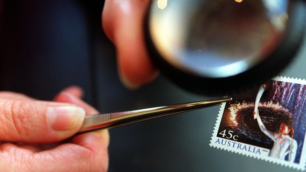 Tweezers and a magnifying glass can be handy for stamp collectors. Picture: Tara Johns