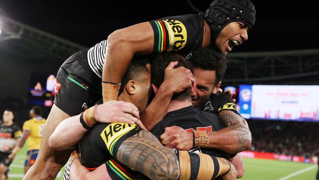 Dylan Edwards was swamped by teammates after winning the Clive Churchill Medal. Picture: Mark Kolbe/Getty Images