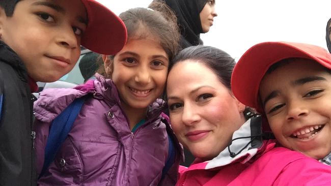 Natasha Exelby poses with young Syrian refugees. Picture: Supplied