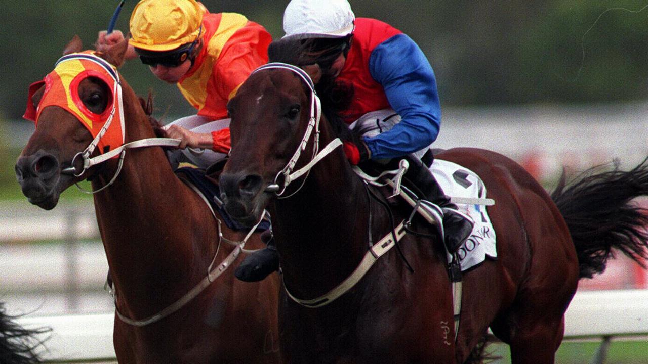 Horseracing - racehorse Secret Savings ridden by jockey Larry Cassidy (outside) grabs All Our Mob to win Doncaster Handicap Race 6 at Randwick.  a/ct