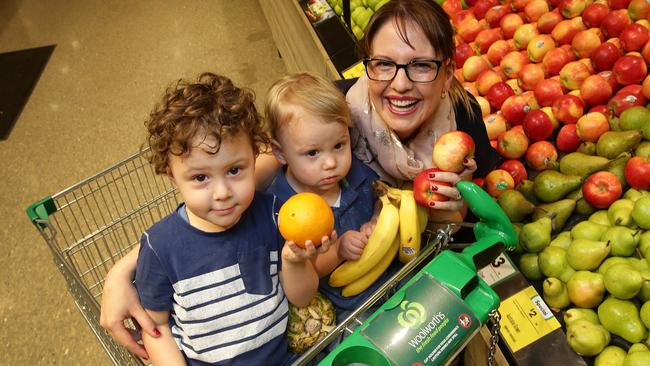 Mum Nicole French with sons Brandon, 3 and Joshua, 1, enjoying some healthy fruit at Moonee Ponds Woolworths.