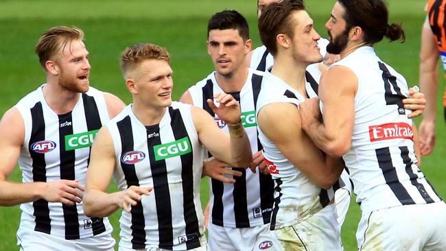 Brodie Grundy (right) and friends give Pies fans plenty to look forward to. Picture: Mark Evans