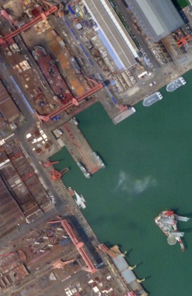 Zubr class hovercraft, a floating dry dock, a floating crane, the new big deck ship under construction dry dock and an apparent trimaran USV are visible. Picture: Planet Labs Inc