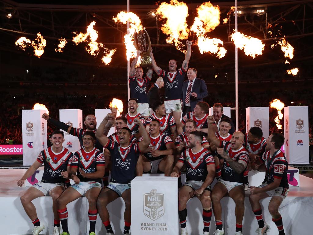 Roosters lift the trophy after winning the 2018 NRL Grand Final between the Sydney Roosters and Melbourne Storm at ANZ Stadium, Sydney. Picture: Brett Costello