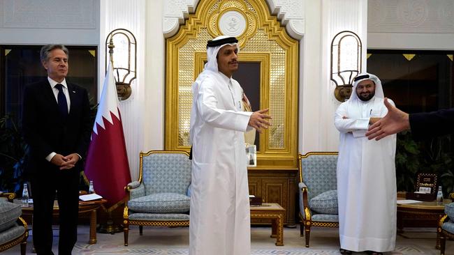 US Secretary of State Antony Blinken, left, also flew to Qatar, where he met with Prime Minister Mohammed bin Abdulrahman al-Thani, centre. Picture: AFP