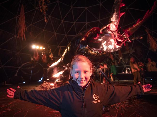 Abby Cameron, 10, with this year’s Ogoh-Ogoh, a Mt Mangana stag beetle. Picture: Chris Kidd