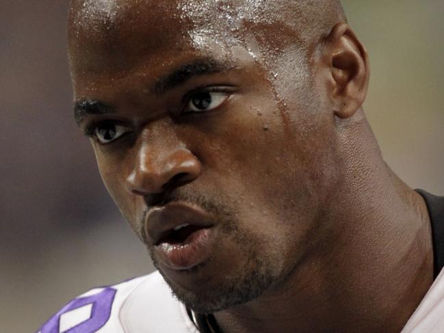 FILE - In this Sept. 7, 2014, file photo, Minnesota Vikings running back Adrian Peterson warms up for an NFL football game against the St. Louis Rams in St. Louis. The Vikings benched Peterson for Sunday's game after his attorney said he had been indicted by a Texas grand jury on a charge of child abuse. Attorney Rusty Hardin says the charge accuses Peterson of using a branch, or switch, to spank his son. He says Peterson has cooperated with authorities and 