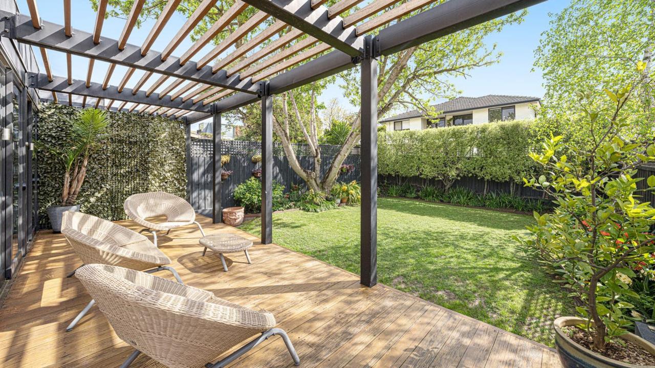 The large backyard and deck, perfect for entertaining.