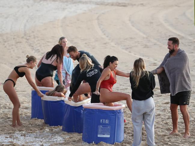 Brave participants as part of a breathing program get into the ice bucket fo rthe first ime on the coldest day of the year on Wednesday morning. Picture: John Grainger