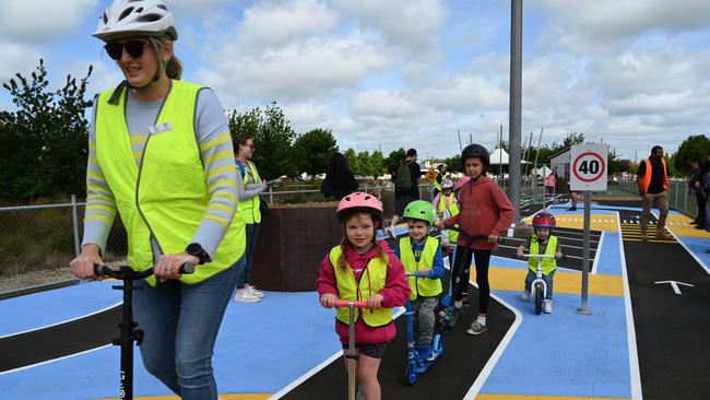 Gladigau educator Kate Ellis and local kindergarteners try out the new learn-to-ride mini streetscape. Picture: City of Mount Gambier