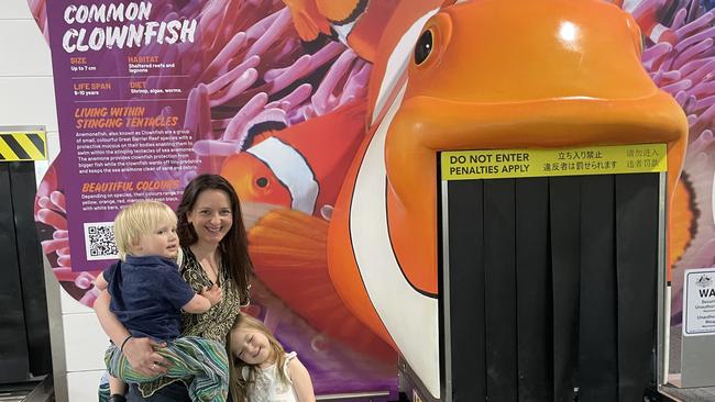 Simone Hutchinson with her son Hamish (two-years-old) and her daughter Lilly (four-years-old) from South Australia. Ms Hutchinson thought the new artwork at the Cairns Airport was great for the children.