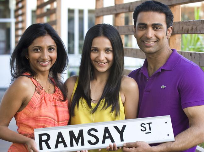 The Kapoors, the new family on TV show Neighbours. Sachin Joab plays Ajay Kapoor, Menik Gooneratne plays Priya Kapoor and Coco-Jacinta Cherin plays their daughter Rani. Ramsay St sign.