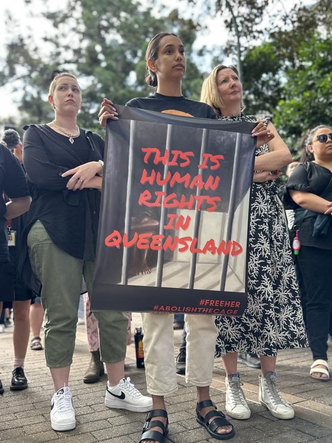 Protesters rally against watch house law changes.