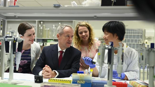 Bill Shorten with Senate candidate Emily Gore, left, and Boothby candidate Nadia Clancy as he speaks to doctor Jing Jing at Flinders University’s College of Medicine in Adelaide yesterday. Picture: AAP