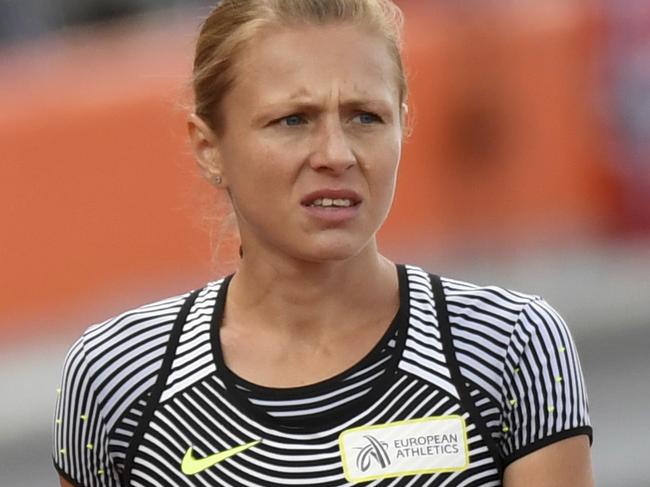 FILE - In this July 6, 2015 file photo Russian doping whistleblower Yuliya Stepanova, who ran under a neutral flag, leaves the track after suffering an injury in a women's 800m heat during the European Athletics Championships in Amsterdam, the Netherlands. Stepanova is in fear of her safety, switching residences after hackers breached a database that records her whereabouts. Stepanova and her husband, Vitaly, were the informers who detailed a state-run doping system in Russia that led to the ouster of the country's athletes from the Olympic track meet. (AP Photo/Geert Vanden Wijngaert, File)