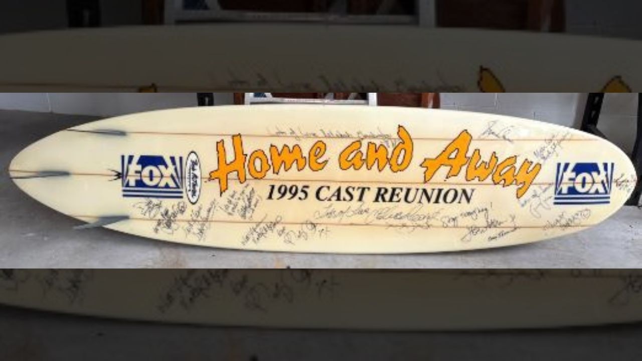 Pictured is the Home &amp; Away 1995 Cast Reunion autographed surfboard.