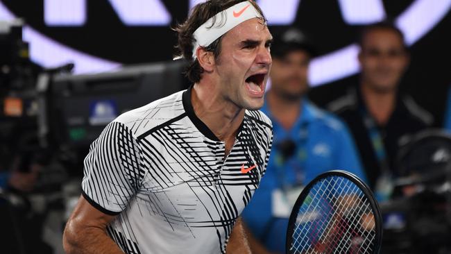 Roger Federer reacts after winning the 2017 Australian Open. Picture: AFP Photo