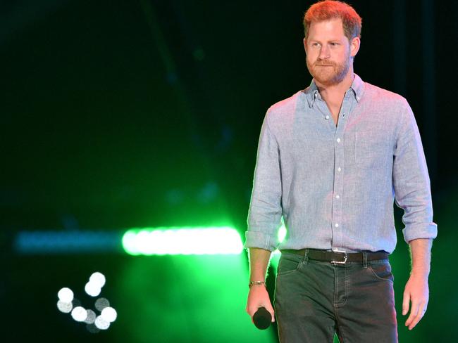 Co-Chair Britain's Prince Harry, Duke of Sussex, arrives onstage to speak during the taping of the 