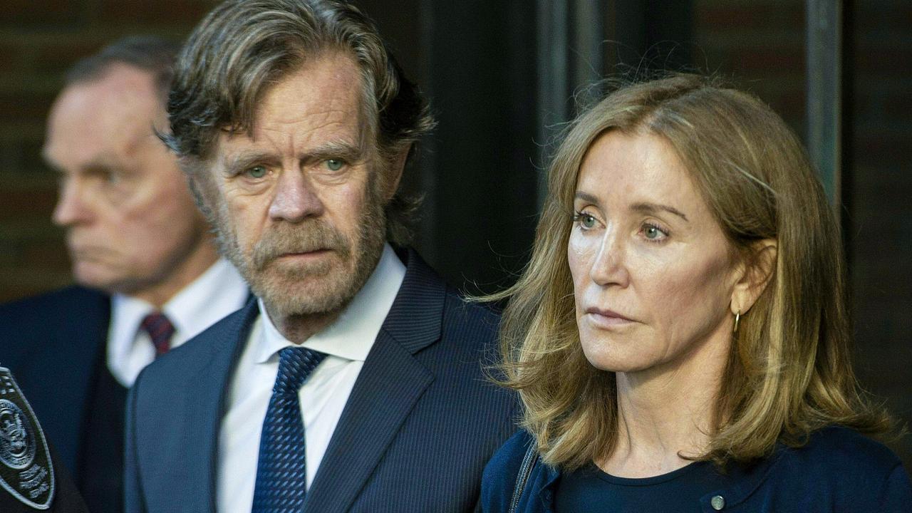 Huffman, escorted by her husband William H. Macy, exits the John Joseph Moakley United States Courthouse in Boston, where she was sentenced. Picture: Joseph Prezioso/AFP