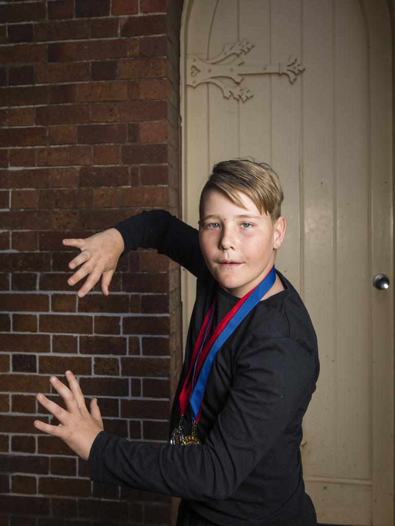 Harry Ryan shows his medals after competing in speech and drama sections of the 77th City of Toowoomba Eisteddfod at Empire Theatres, Monday, July 31, 2023. Picture: Kevin Farmer