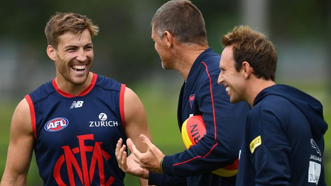 Jack Viney of the Demons speaks to Mark Visser and Trevor Hendy during a Melbourne training session at Gosch's Paddock. Picture: Quinn Rooney/Getty Images