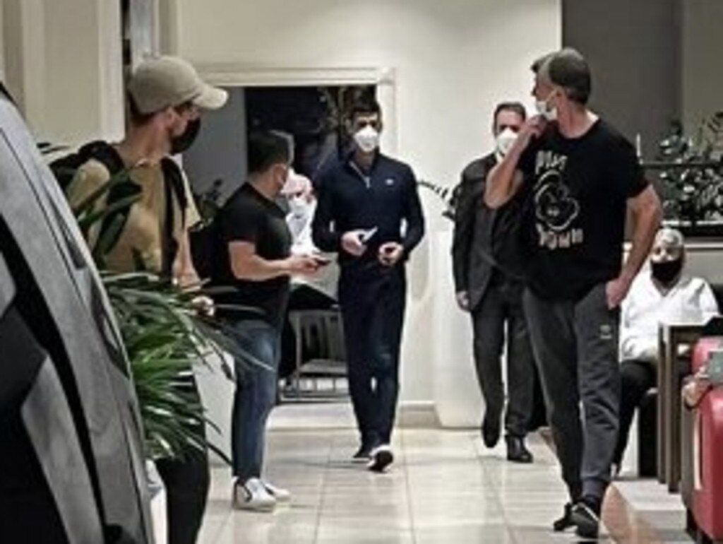 Novak Djokovic (centre) with his entourage at Melbourne Airport for flight back to Europe. Picture: Shane McInnes/Twitter