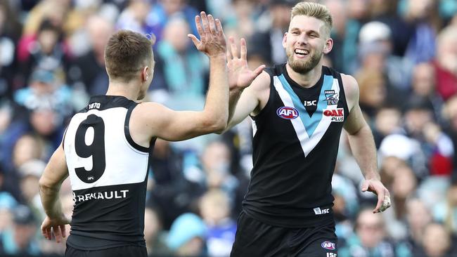 Jackson Trengove celebrates a goal with Robbie Gray. Picture: Sarah Reed