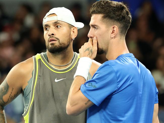 MELBOURNE, AUSTRALIA - JANUARY 16: Nick Kyrgios and Thanasi Kokkinakis of Australia speak in the Men's Doubles First Round match against James Duckworth and Aleksandar Vukic of Australia during day five of the 2025 Australian Open at Melbourne Park on January 16, 2025 in Melbourne, Australia. (Photo by Cameron Spencer/Getty Images)