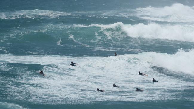 Surfers take on huge waves at Bronte Beach after days of wild storms lashed Sydney. Picture by Max Mason-Hubers