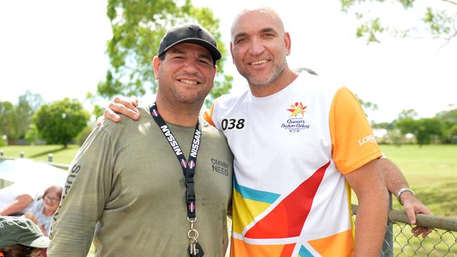 Gorden Tallis with Carl Webb in Townsville during the baton realy of the 2018 Commonwealth Games. Picture: Alix Sweeney