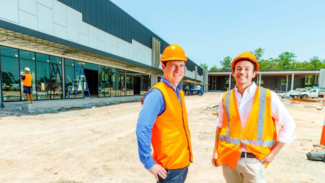 BMI Group’s John Curtis and Michael Irvine inspect progress at The Depot, the first stage of the Rivermakers development off Lytton Rd, Morningside. Picture: AAP/Richard Walker